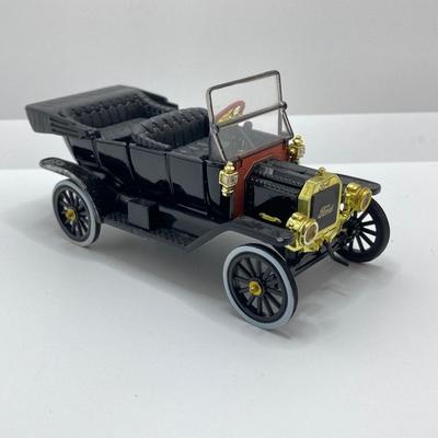 LOT 582: Ford Automobile Collection - Toy Cars, True Value Ertl Bank and Trivet