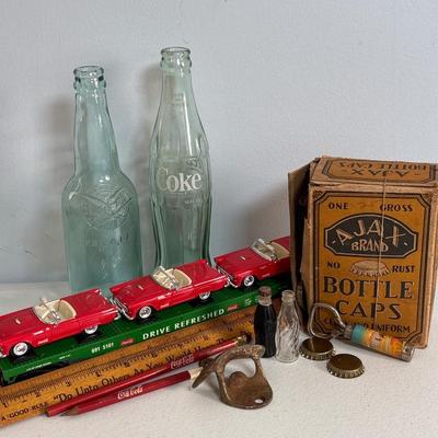 LOT 603: Have a Coke and a Smile; Vintage Coca Cola Rulers, Pencils, Bottles, Train Car Carrier, Bottle Opener, & Box of Ajax Bottlecaps