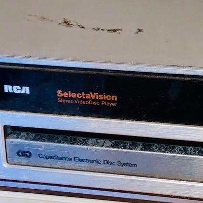LOT 611: Vintage Laser Disc Technology - RCA SelectaVision Stereo Video Disc Player Model SGT 200 with a Large Assortment of Laser Discs...