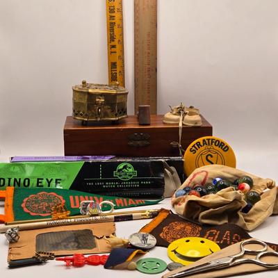 LOT 616: Chinese Cricket Box, "Lost World Watches", Small Pennant Flags, Marbles, Bruce Wayne Ring, Rulers, Wooden Box,& More