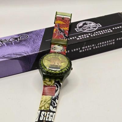 LOT 616: Chinese Cricket Box, "Lost World Watches", Small Pennant Flags, Marbles, Bruce Wayne Ring, Rulers, Wooden Box,& More