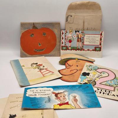 LOT 619: Various Postcards, Greeting Cards, Comic Strips, Matches, Stamps, & Coin Trick Block Puzzle Instructions