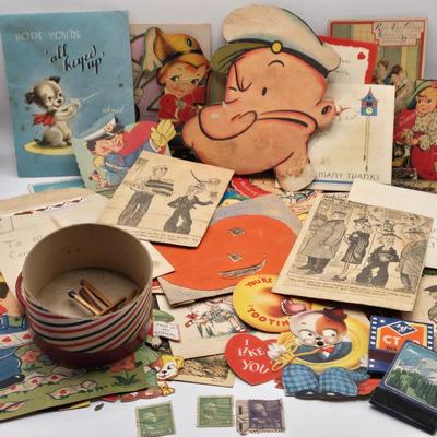 LOT 619: Various Postcards, Greeting Cards, Comic Strips, Matches, Stamps, & Coin Trick Block Puzzle Instructions