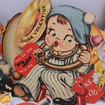 LOT 619: Various Postcards, Greeting Cards, Comic Strips, Matches, Stamps, & Coin Trick Block Puzzle Instructions