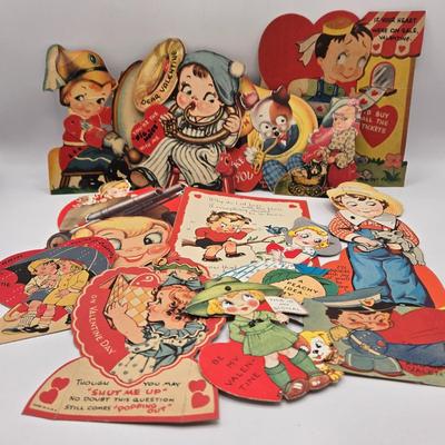 LOT 619: Various Postcards, Greeting Cards, Comic Strips, Matches, Stamps, & Coin Trick Block Puzzle Instructions