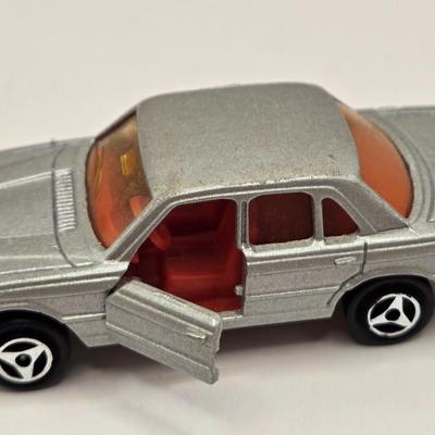 LOT 623: Honda Repair Guide Book, 1976 Cadillac Owner's Manuel, Various Die Cast Metal Cars, Morris Garages Car Logo Patches,...