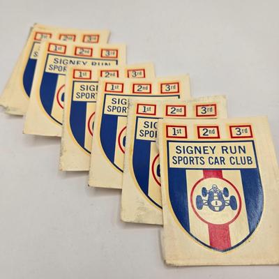 LOT 623: Honda Repair Guide Book, 1976 Cadillac Owner's Manuel, Various Die Cast Metal Cars, Morris Garages Car Logo Patches,...