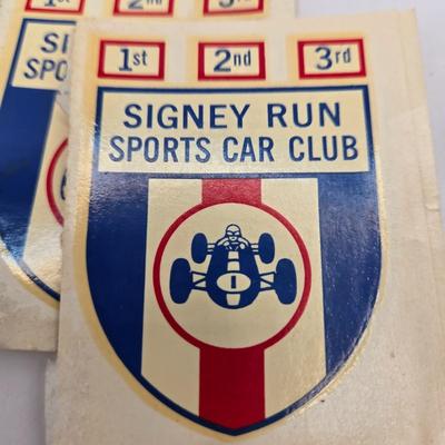 LOT 623: Honda Repair Guide Book, 1976 Cadillac Owner's Manuel, Various Die Cast Metal Cars, Morris Garages Car Logo Patches,...
