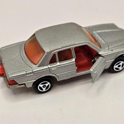 LOT 623: Honda Repair Guide Book, 1976 Cadillac Owner's Manuel, Various Die Cast Metal Cars, Morris Garages Car Logo Patches,...