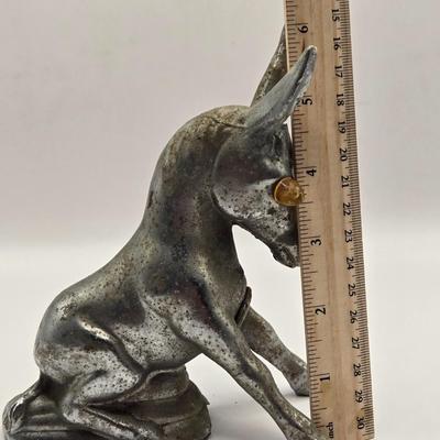LOT 625: Vintage Metal Donkey Hood Ornament with Illuminated Amber Eyes