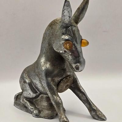 LOT 625: Vintage Metal Donkey Hood Ornament with Illuminated Amber Eyes