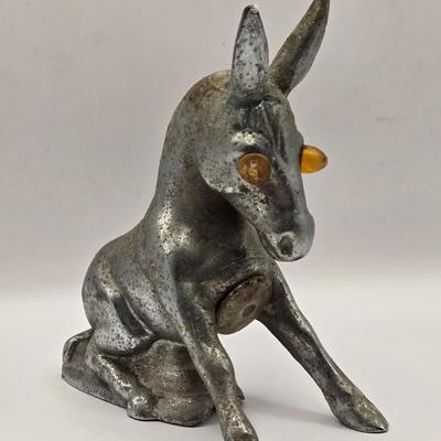 LOT 625: Vintage Metal Donkey Hood Ornament with Illuminated Amber Eyes