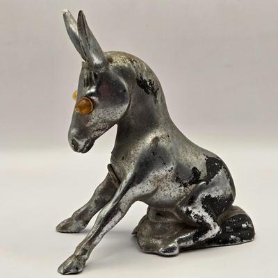 LOT 625: Vintage Metal Donkey Hood Ornament with Illuminated Amber Eyes