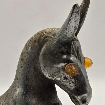 LOT 625: Vintage Metal Donkey Hood Ornament with Illuminated Amber Eyes