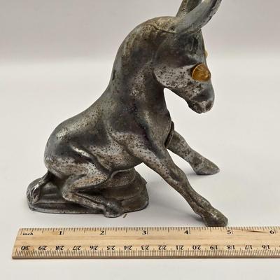 LOT 625: Vintage Metal Donkey Hood Ornament with Illuminated Amber Eyes