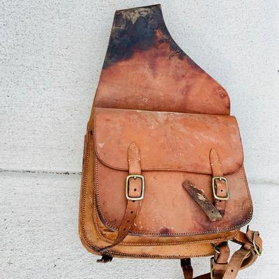 LOT 629: Assortment of Horse Tack Including Bits, Reins and More and a Leather Saddle Bag