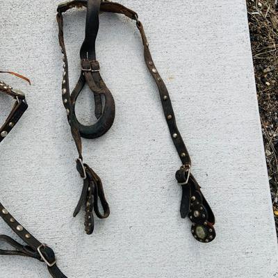 LOT 629: Assortment of Horse Tack Including Bits, Reins and More and a Leather Saddle Bag