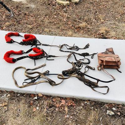 LOT 629: Assortment of Horse Tack Including Bits, Reins and More and a Leather Saddle Bag