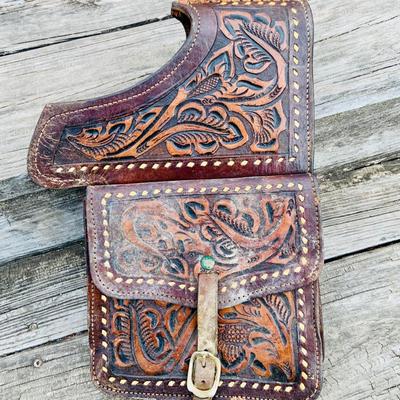LOT 630: Assortment of Horse Tack Including Bits, Reins and More and a Leather Saddle Bag