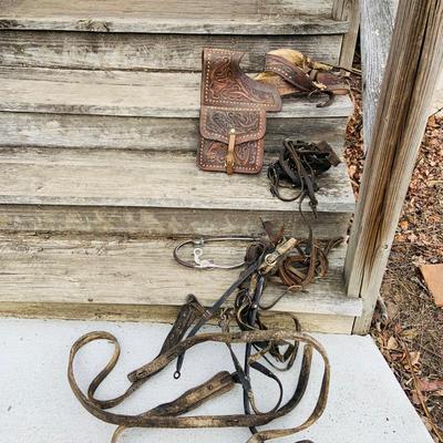 LOT 630: Assortment of Horse Tack Including Bits, Reins and More and a Leather Saddle Bag