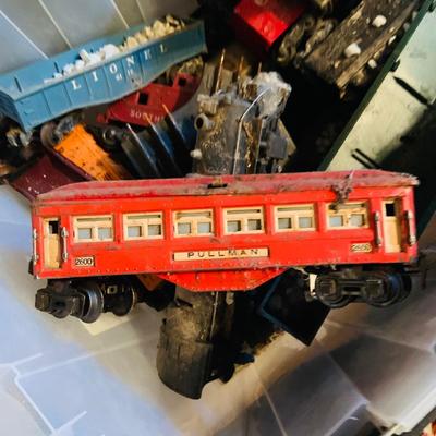 LOT 635: Bin of Vintage O Scale Miniature Trains and Fall Accessories