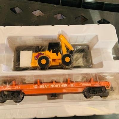 LOT 638: Set of Two (2) K -Line Operating Freight Cars - K724-2011 Operating Coal Dump Car and K 723 x1591 Operating Log Dump Car
