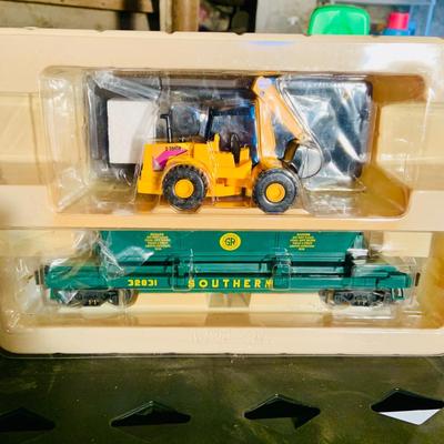 LOT 638: Set of Two (2) K -Line Operating Freight Cars - K724-2011 Operating Coal Dump Car and K 723 x1591 Operating Log Dump Car