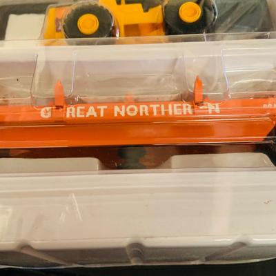 LOT 638: Set of Two (2) K -Line Operating Freight Cars - K724-2011 Operating Coal Dump Car and K 723 x1591 Operating Log Dump Car