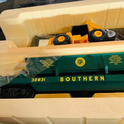 LOT 638: Set of Two (2) K -Line Operating Freight Cars - K724-2011 Operating Coal Dump Car and K 723 x1591 Operating Log Dump Car