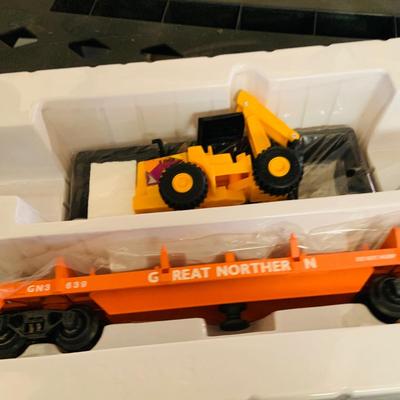 LOT 638: Set of Two (2) K -Line Operating Freight Cars - K724-2011 Operating Coal Dump Car and K 723 x1591 Operating Log Dump Car