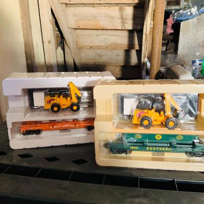 LOT 638: Set of Two (2) K -Line Operating Freight Cars - K724-2011 Operating Coal Dump Car and K 723 x1591 Operating Log Dump Car