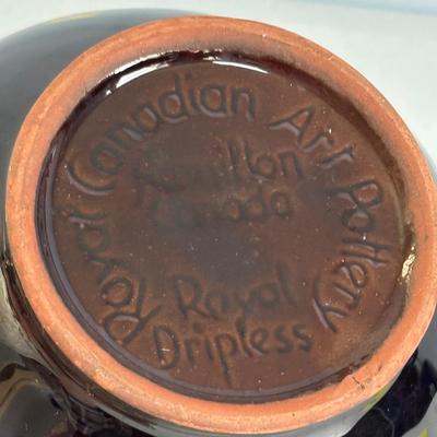 LOT 656: Vintage Amber Glass Jeannette Dish, Royal Canadian Art Pottery Tea Pot, Wooden Mortar & Pestel, Portugal. Olive Green Eagle...