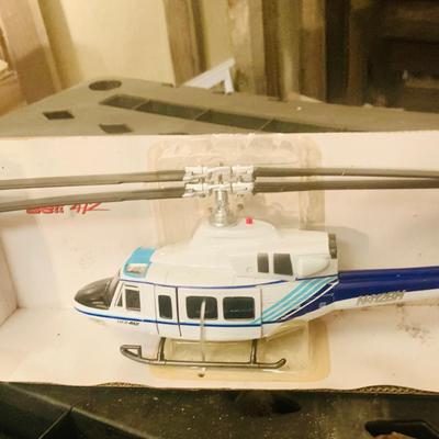 LOT 659: K-Line Aviation K40226 Army Air Corp P40 Fighter Plane and K-Line K-94701 Bell 412 Die Cast Helicopter