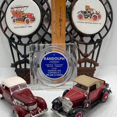 LOT 660: Vintage Automobile Collection - Die Cast Toy Cars (Chevrolet / Cord), Apco Japan Trivets and Randolph Chevrolet Ashtray