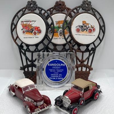 LOT 660: Vintage Automobile Collection - Die Cast Toy Cars (Chevrolet / Cord), Apco Japan Trivets and Randolph Chevrolet Ashtray