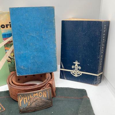 LOT 661: Boy Scout Collection - Books, Patches, Tokens, Hat, Philmont Belt and Luminous Pocket Planetarium