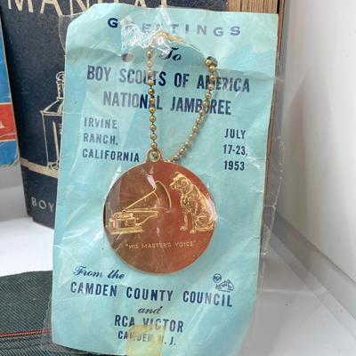LOT 661: Boy Scout Collection - Books, Patches, Tokens, Hat, Philmont Belt and Luminous Pocket Planetarium
