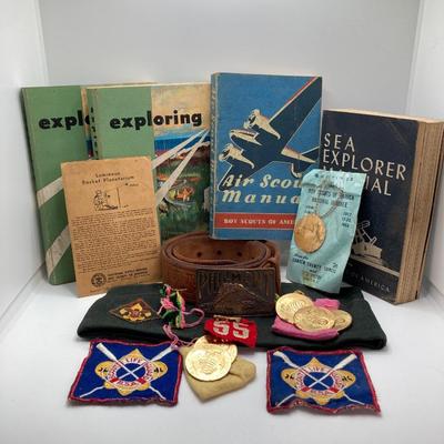 LOT 661: Boy Scout Collection - Books, Patches, Tokens, Hat, Philmont Belt and Luminous Pocket Planetarium