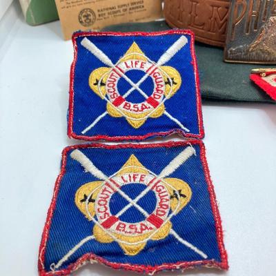 LOT 661: Boy Scout Collection - Books, Patches, Tokens, Hat, Philmont Belt and Luminous Pocket Planetarium