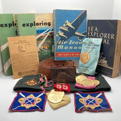 LOT 661: Boy Scout Collection - Books, Patches, Tokens, Hat, Philmont Belt and Luminous Pocket Planetarium