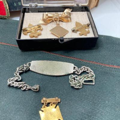LOT 663: Boy Scouts Vintage Memorabilia - Jewelry / Pins, Hat, Token Coins, Order of the Arrow Books and More