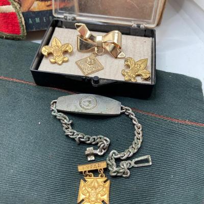 LOT 663: Boy Scouts Vintage Memorabilia - Jewelry / Pins, Hat, Token Coins, Order of the Arrow Books and More