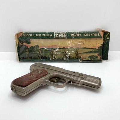 LOT 665: Vintage Toy Army 45 Cap Gun and Tru-Size Metal Miniature Toy Figurines