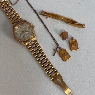 LOT: 702: Gold Tone Croton Watch, Anson Pt. Pending Tie Bar, Chain with Cross Charm, Two Gold Tone "50" Charms, &...