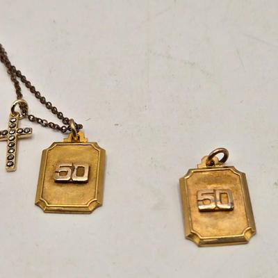 LOT: 702: Gold Tone Croton Watch, Anson Pt. Pending Tie Bar, Chain with Cross Charm, Two Gold Tone "50" Charms, &...
