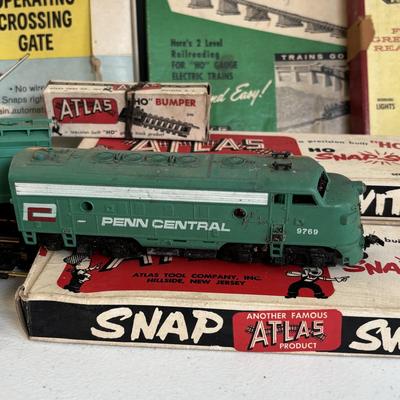 LOT 726: Vintage Train Accessories: Atlas HO Scale Track, Atlas Set, Revell HO Accessories & Aristo-Craft along with a Tyco Penn Line...