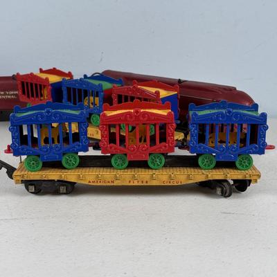 LOT 735: Red Locomotive & Tinder Car, American Flyer Circus Flat Cars with Cages & Truck/Tractors