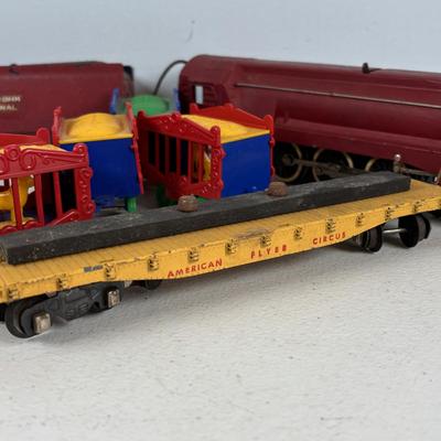 LOT 735: Red Locomotive & Tinder Car, American Flyer Circus Flat Cars with Cages & Truck/Tractors