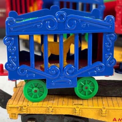 LOT 735: Red Locomotive & Tinder Car, American Flyer Circus Flat Cars with Cages & Truck/Tractors
