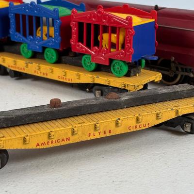 LOT 735: Red Locomotive & Tinder Car, American Flyer Circus Flat Cars with Cages & Truck/Tractors